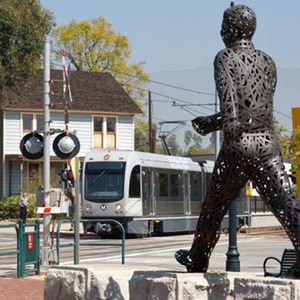 A statue of a man crossing a road