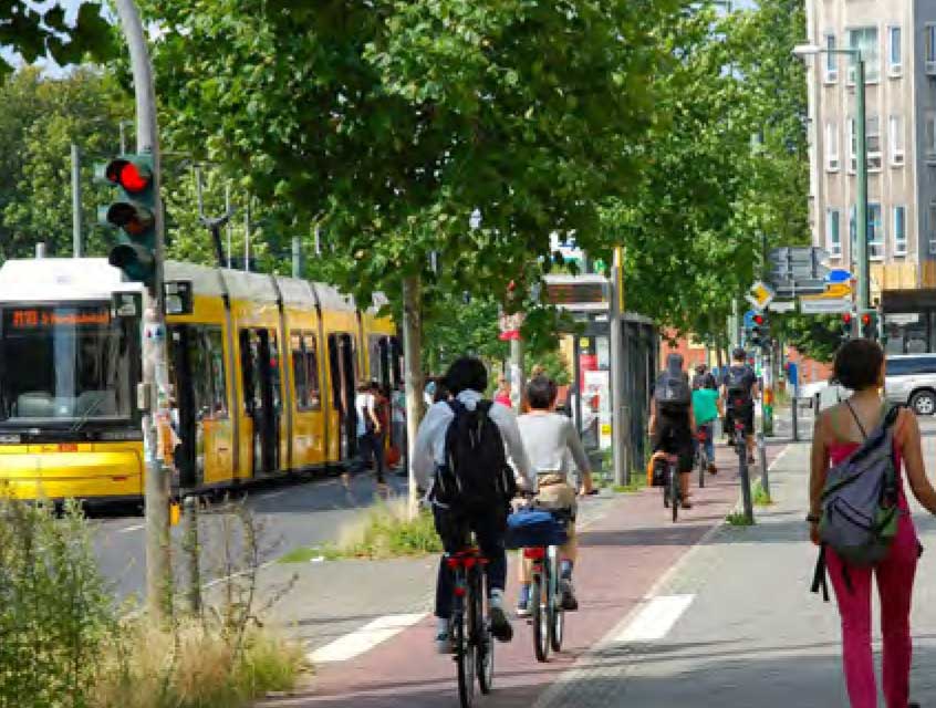 Bikers on a busy street.