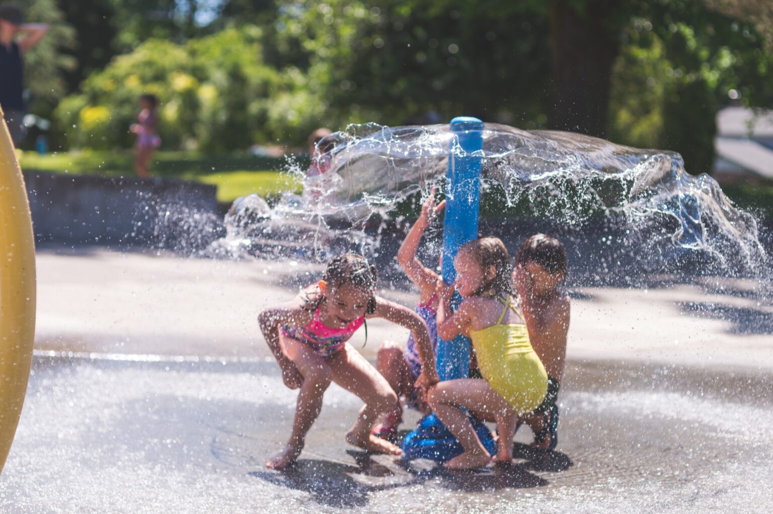 Kids playing in outdoor water features