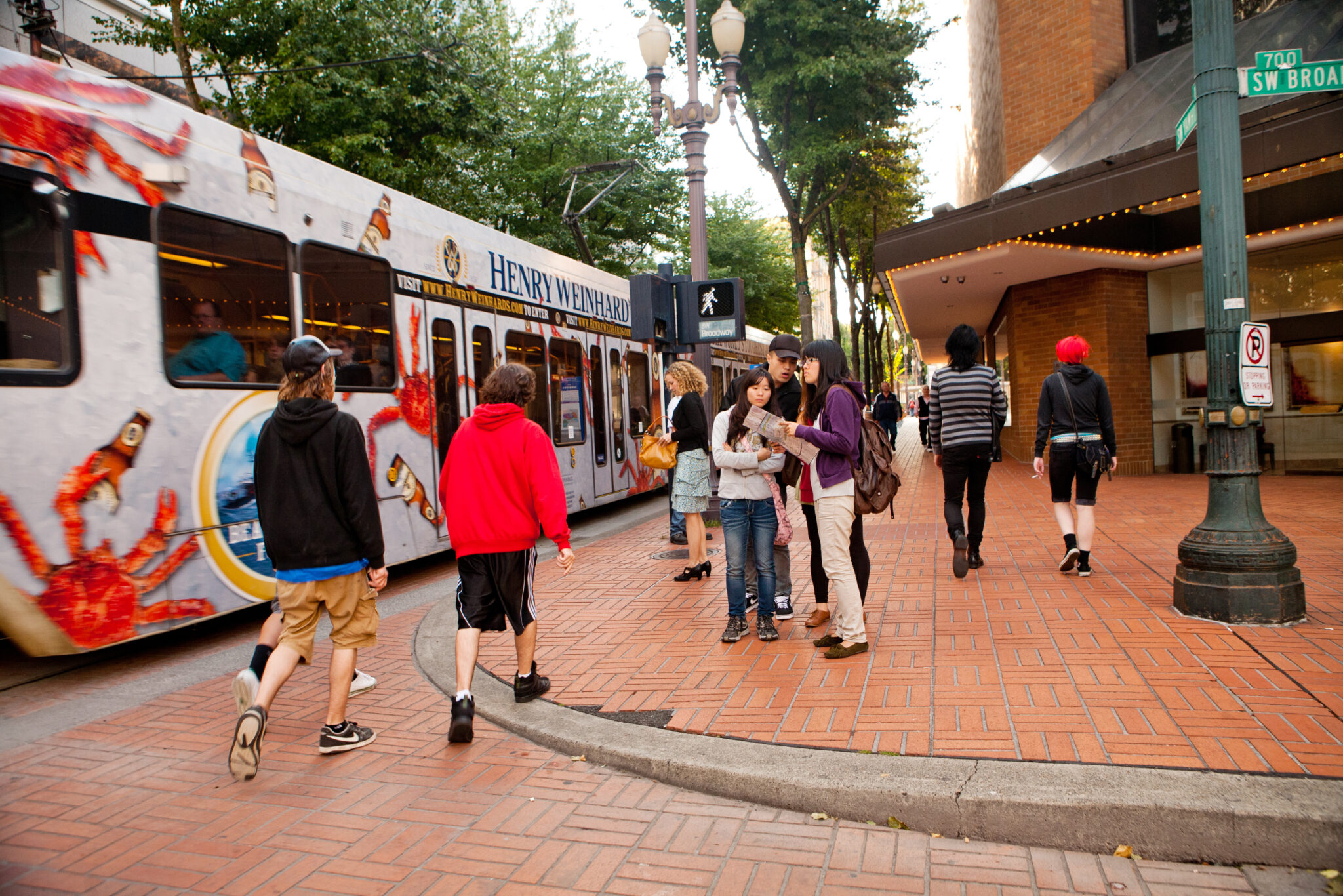"Portland, Oregon, USA - September 13, 2011: People walking on the sidewalk and waiting for the MAX lightrail in downtown Portland."