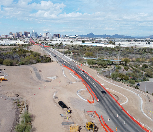 Construction of light rail transit extension to South Phoenix, with downtown Phoenix in the background