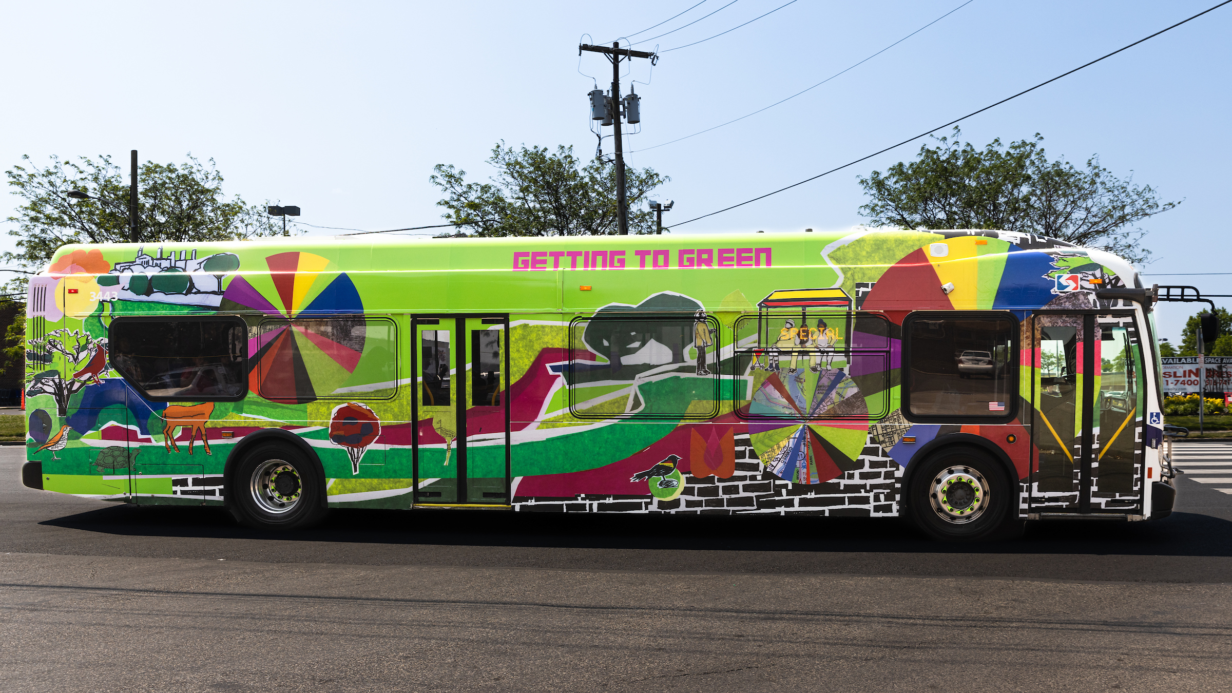 Bus with Getting to Green artwork wrap.